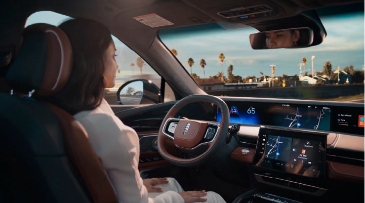 A person is shown driving hands-free on the highway with available Lincoln BlueCruise technology. | Caruso Lincoln in Long Beach CA