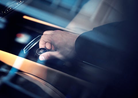 The driver of a 2023 Lincoln Corsair® SUV is shown adjusting the drive mode. | Caruso Lincoln in Long Beach CA