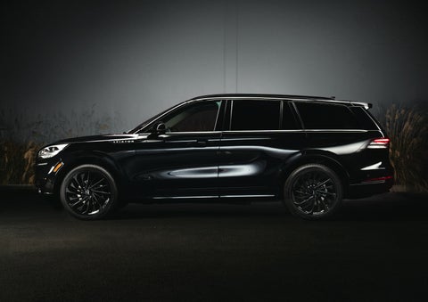 A 2024 Lincoln Aviator® SUV is shown in the Infinite Black exterior color | Caruso Lincoln in Long Beach CA