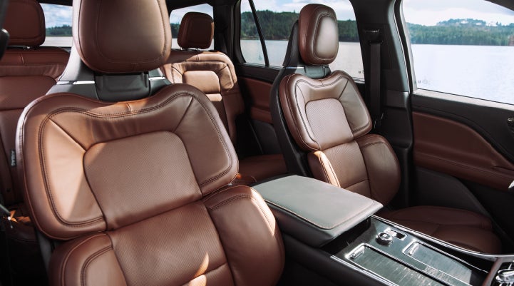 The front row's Perfect Position Seats in a 2024 Lincoln Aviator® Reserve model with Ebony Roast interior | Caruso Lincoln in Long Beach CA