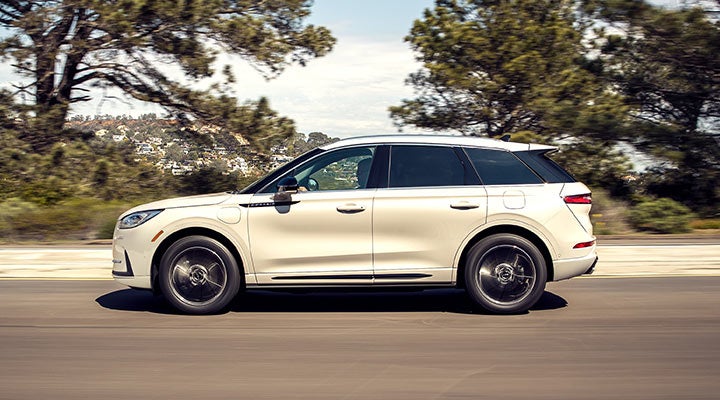 A 2024 Lincoln Corsair® Grand Touring model is being driven in the countryside.