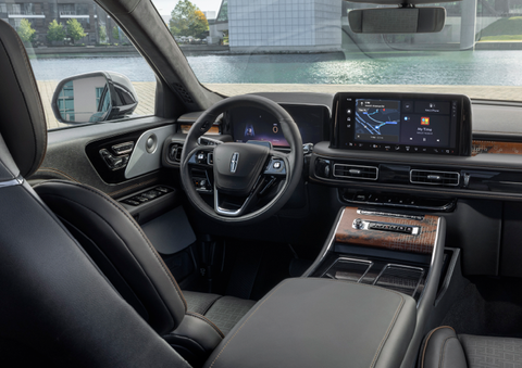 The interior of the 2025 Lincoln Aviator® SUV is shown parked with a view of a harbor through the windshield. | Caruso Lincoln in Long Beach CA