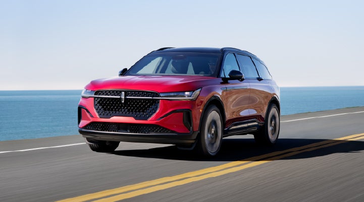A 2025 Lincoln Nautilus® SUV is being driven on a seaside roadway. | Caruso Lincoln in Long Beach CA