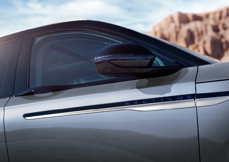 Blue lettering on the side of the vehicle that reads nautilus indicates the available hybrid powertrain. | Caruso Lincoln in Long Beach CA