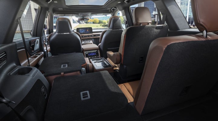 One side of the PowerFold® third-row seat and a second-row seat are folded forward in the 2026 Lincoln Aviator® SUV. | Caruso Lincoln in Long Beach CA