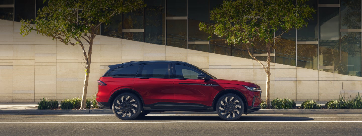 A 2026 Lincoln Nautilus® SUV with an available Hybrid Powertrain is parked in an urban setting. | Caruso Lincoln in Long Beach CA
