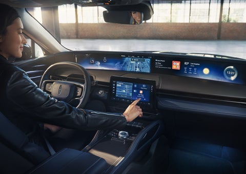 The driver of a 2026 Lincoln Nautilus® SUV interacts with the center touchscreen. | Caruso Lincoln in Long Beach CA
