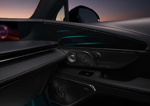 Selectable ambient lighting glows in the passenger door panel. | Caruso Lincoln in Long Beach CA