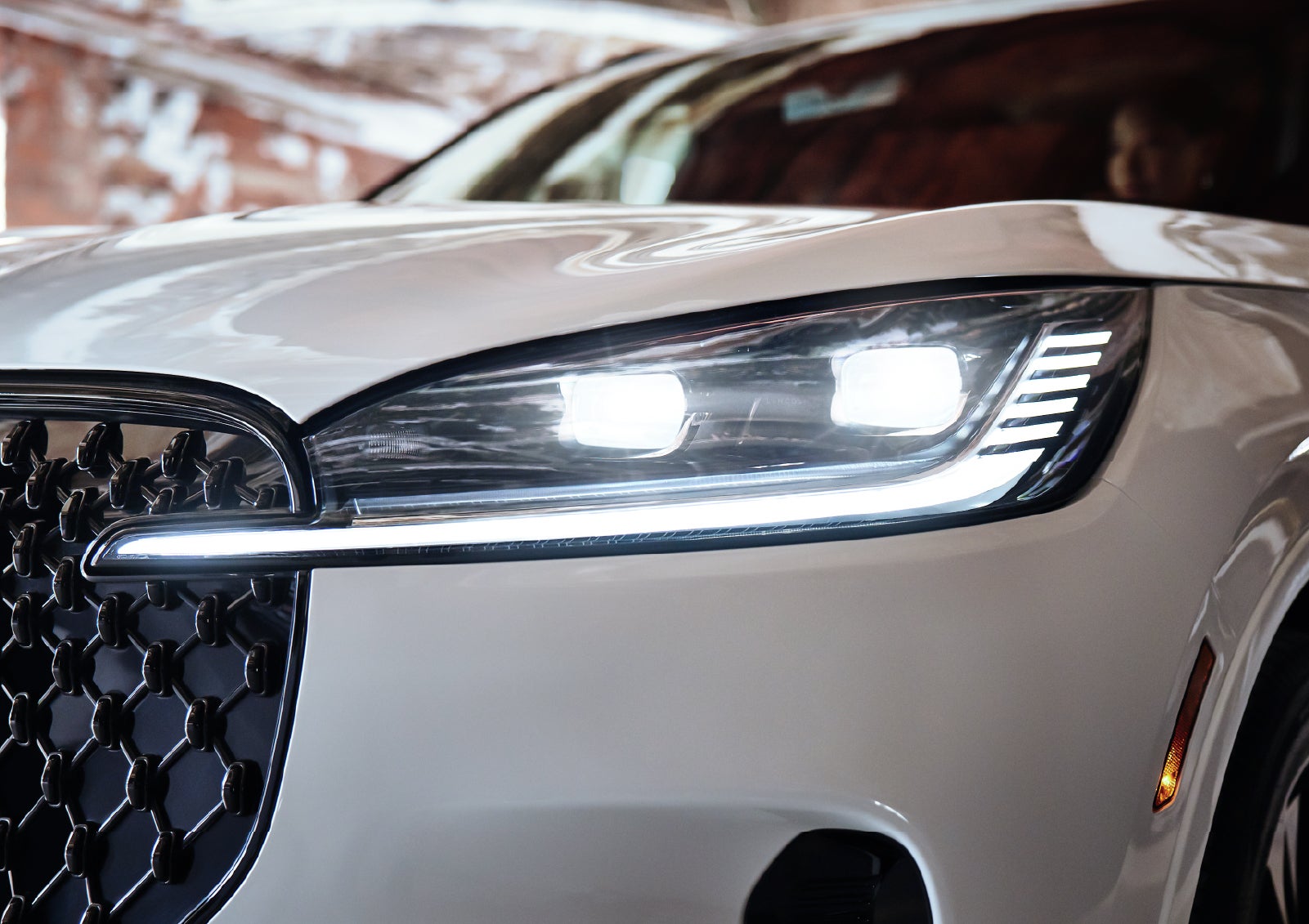 A close-up of a headlamp on the 2027 Lincoln Aviator® SUV is shown. | Caruso Lincoln in Long Beach CA
