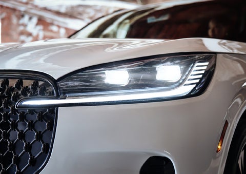 A close-up of a headlamp on the 2027 Lincoln Aviator® SUV is shown. | Caruso Lincoln in Long Beach CA